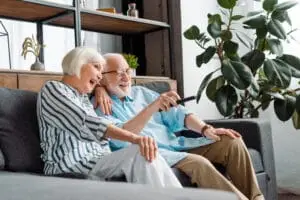 Seniors watching television marketing advertisements